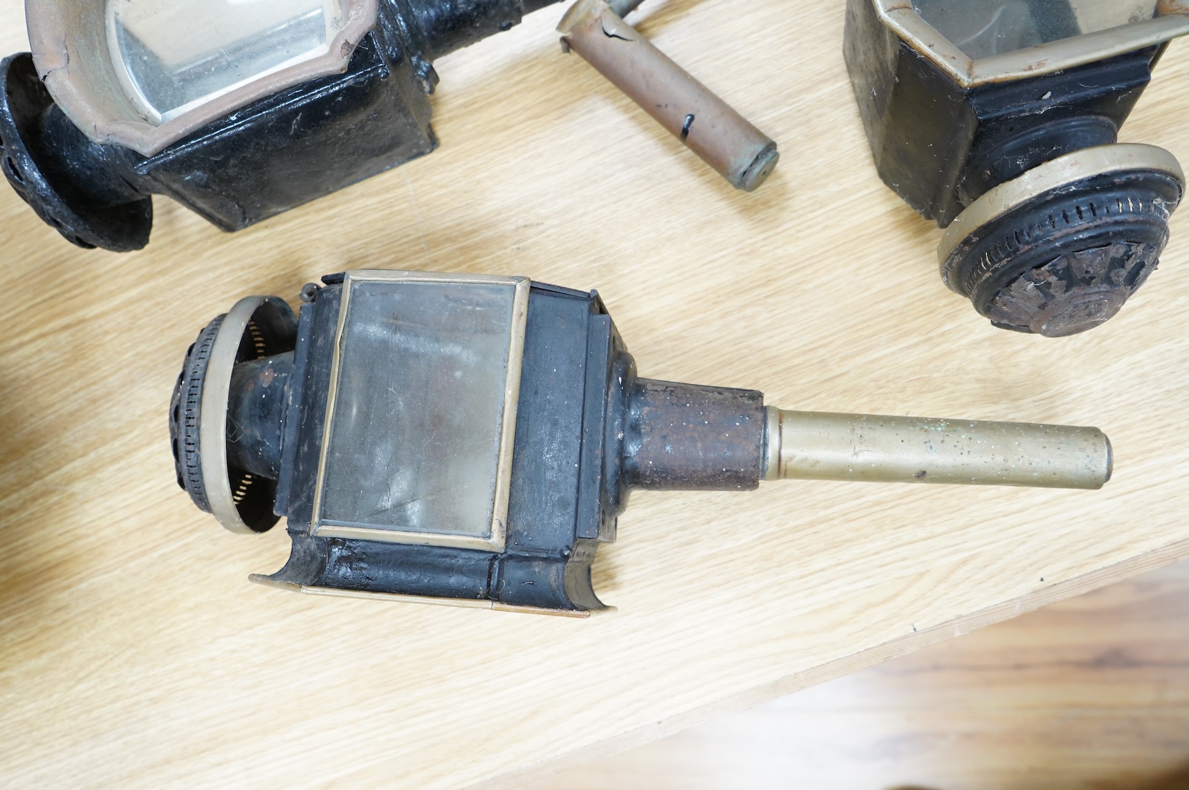 A pair of late 19th century carriage lamps and another